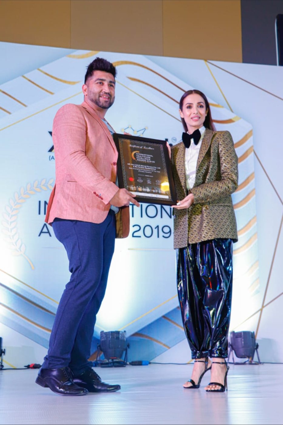 Best Emerging Entrepreneur of the Year (Fitness Industry) for MnRaj Fitness Pvt. Ltd. & RD Fitness Equipments, presented by Malaika Arora.